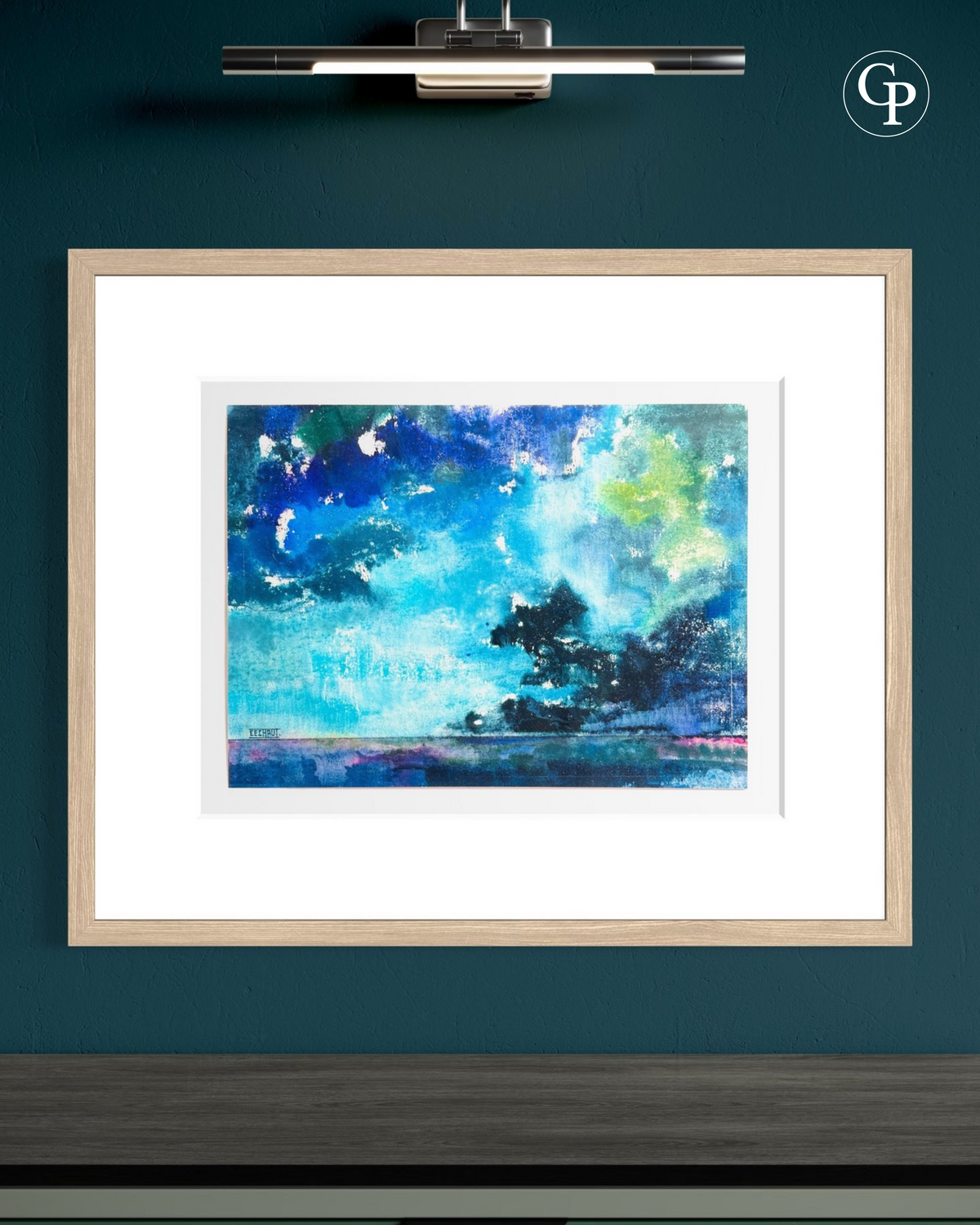 Framed original watercolor La Nuée by Eugène Eechaut in a light wood frame with picture lighting on a dark teal wall | Mise en situation de l'aquarelle originale La Nuée par Eugène Eechaut avec cadre en bois clair sous éclairage de tableau sur mur bleu canard Galerie Popincourt