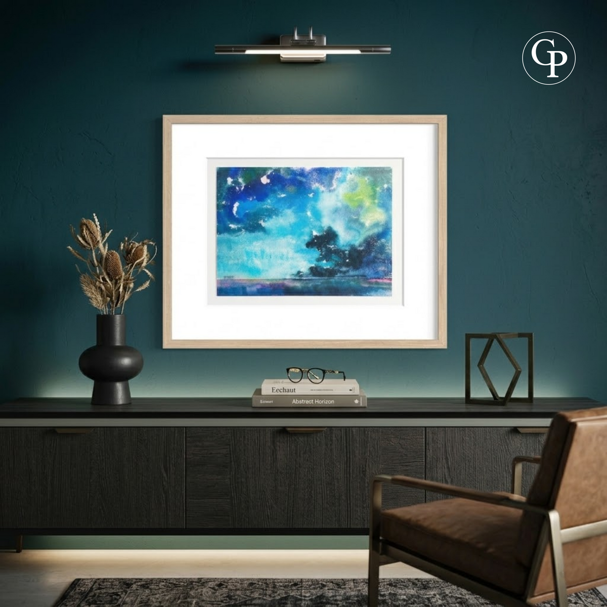 Framed original watercolor La Nuée by Eugène Eechaut hung on a dark teal wall above a modern black wooden sideboard | Mise en situation d'ambiance de l'aquarelle originale La Nuée par Eugène Eechaut encadrée sur mur bleu canard sombre Galerie Popincourt