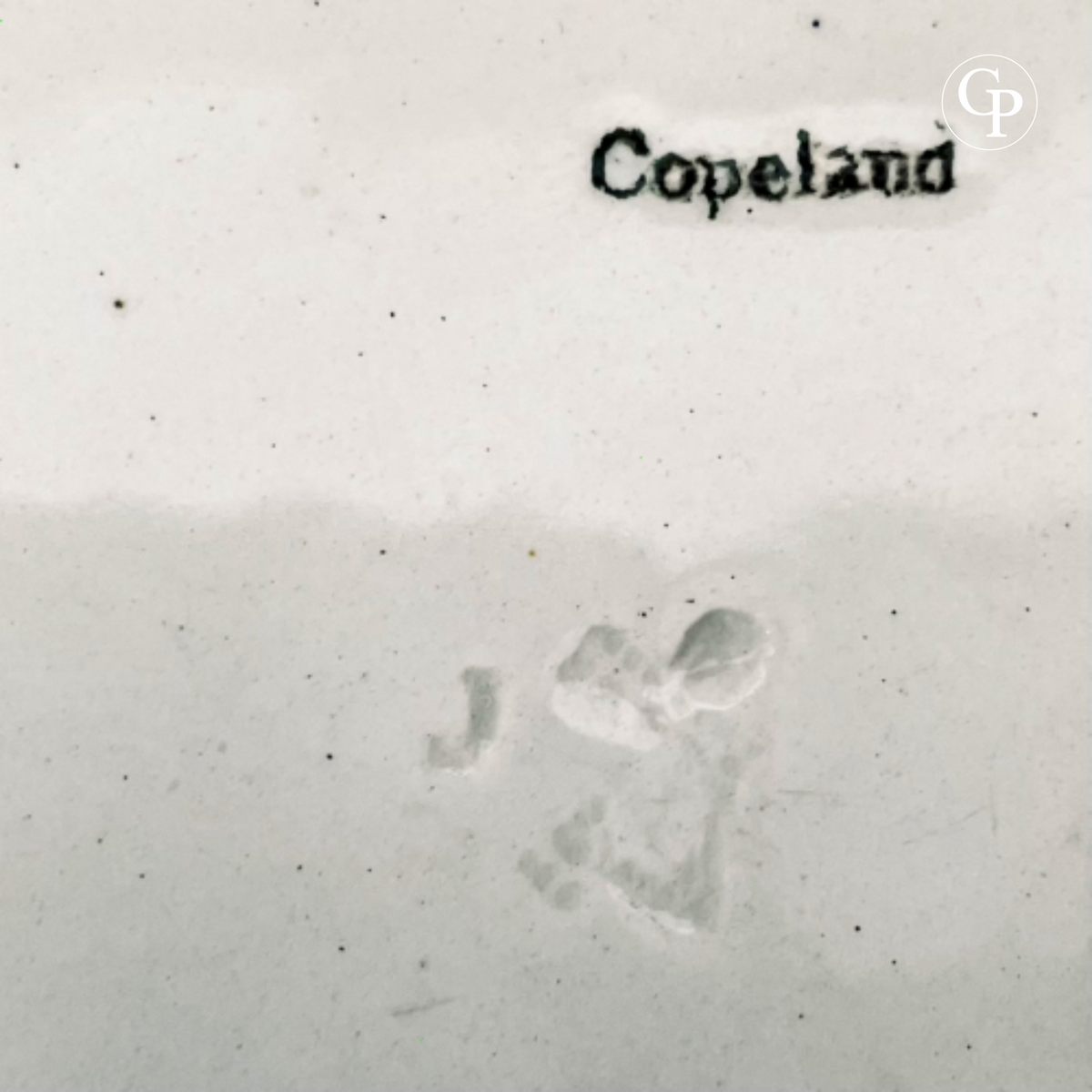 Close-up of the “Copeland” manufacturer’s mark on the back of the Victorian Ironstone serving dish, with the raised factory stamp visible.